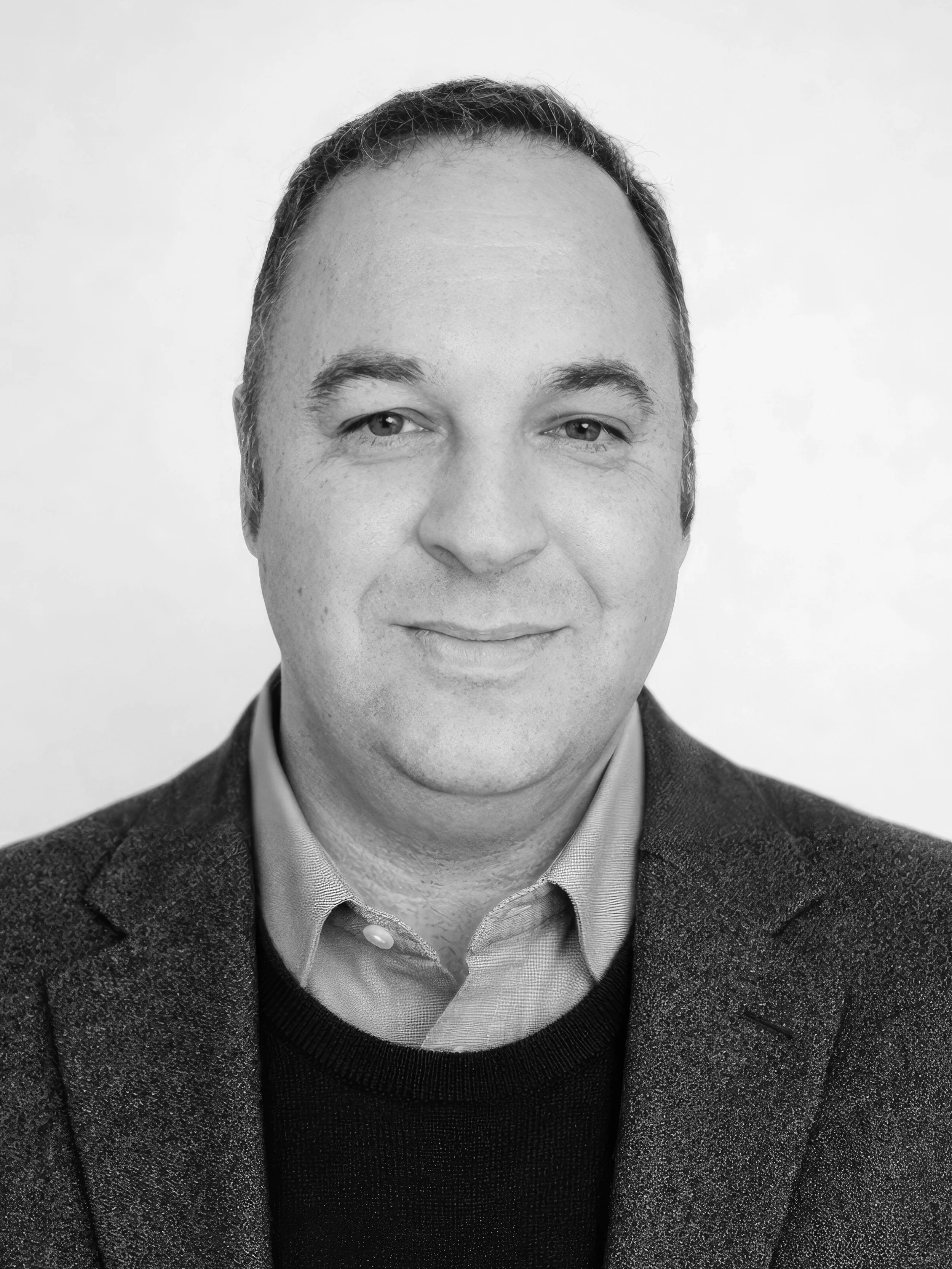 Nicholas Taylor — Author headshot, black and white photo of Nicholas Taylor in a blazer